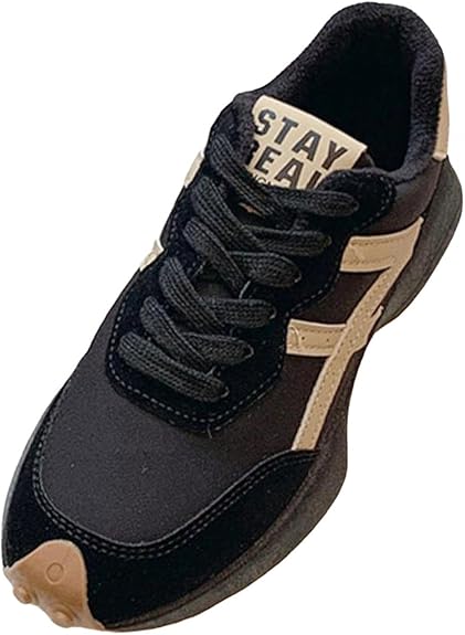 Zapatilla negra para mujer.