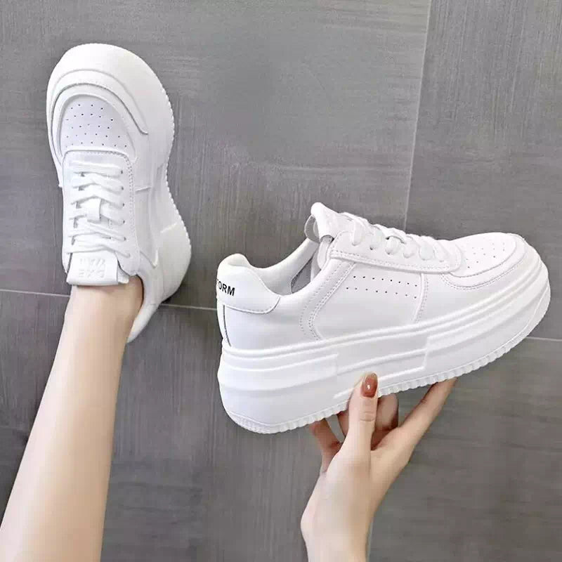 Zapatillas de lona blancas para mujer.