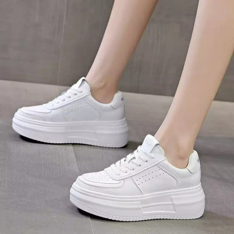 Zapatillas de lona blancas para mujer.