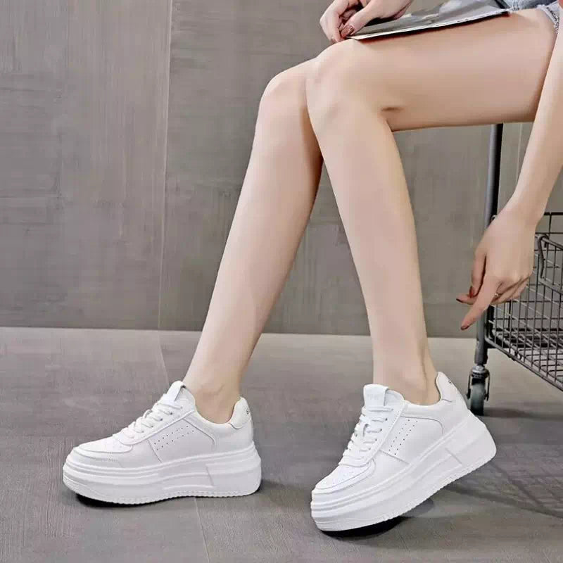 Zapatillas de lona blancas para mujer.